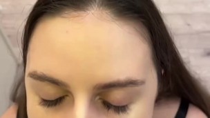 beautiful brunette with beautiful eyes gives a blowjob